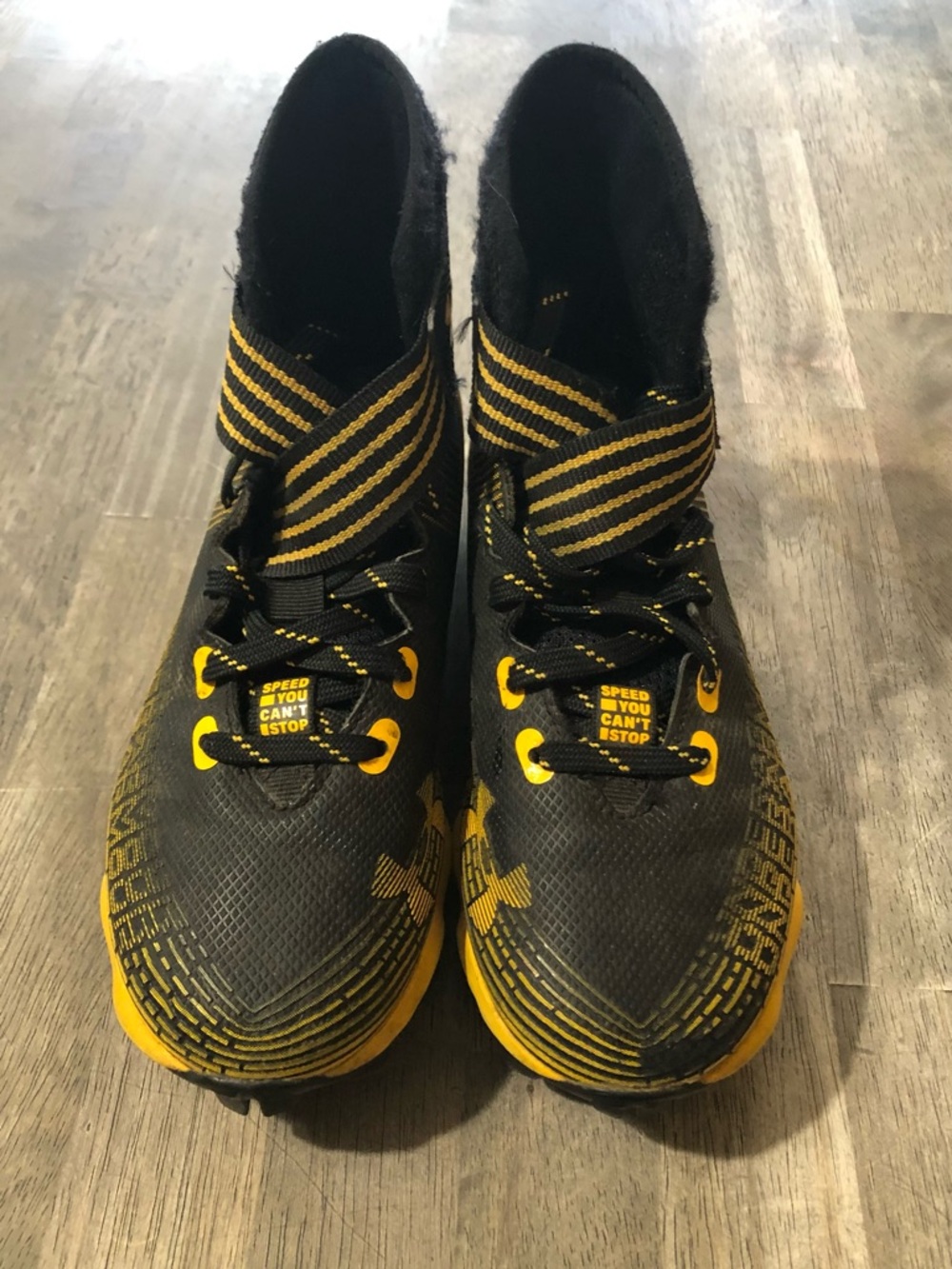 Under Armour Black and Yellow Kids Athletic Football Cleats